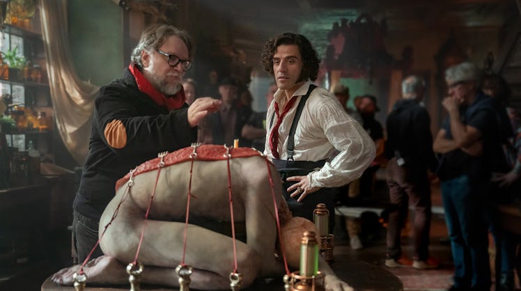 Guillermo del Toro and Oscar Isaac behind the scenes of Frankenstein