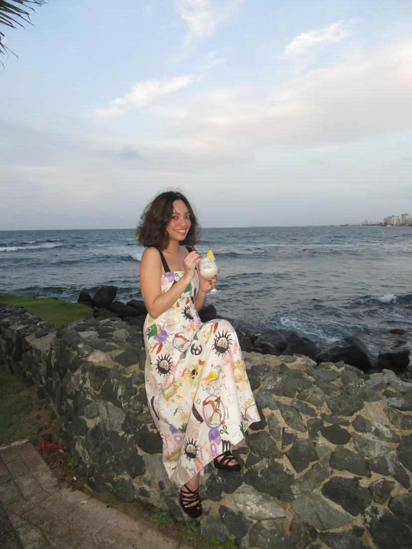 The writer with a piña colada at Caribe Hilton.