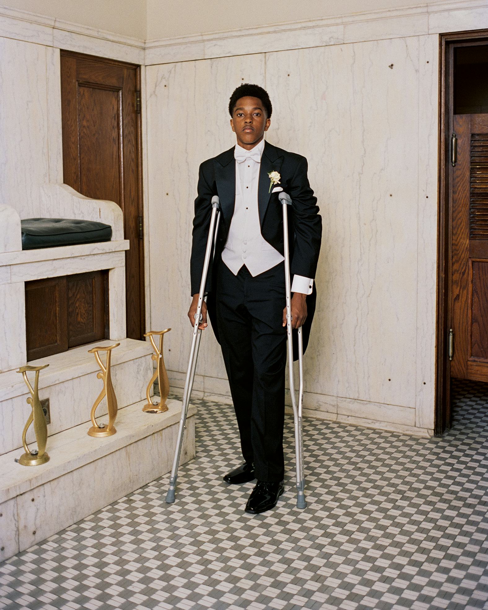 A young Black man in his cotillion suit, from Social Season (Important Flowers, 2026)
