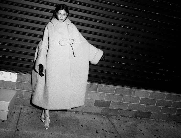 Loli Bahia wears a Maison Margiela Artisanal by John Galliano coat and shoes; stylist’s own gloves.