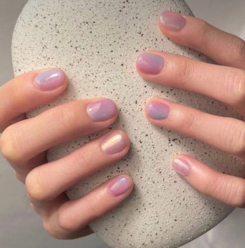 The opalescent nail trend adds an otherworldly glow to your winter manicures.