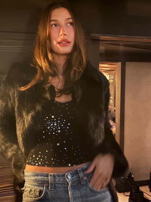 Hailey Bieber with long hair in a fur jacket
