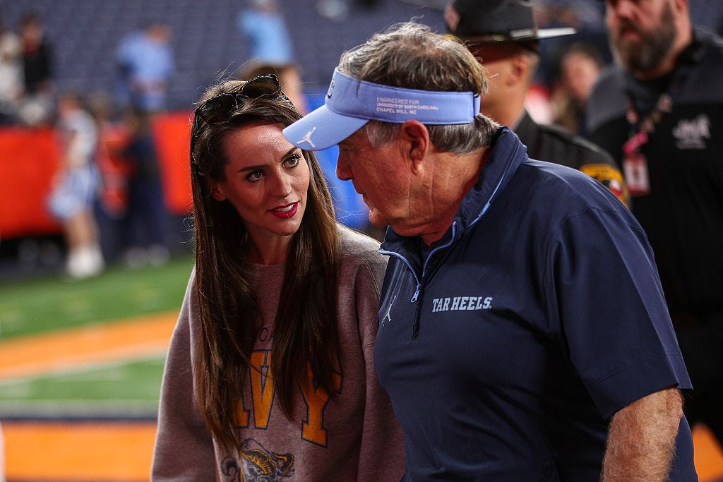 SYRACUSE, NEW YORK - OCTOBER 31: Jordan Hudson speaks with Bill Belichick of the North Carolina Tar ...