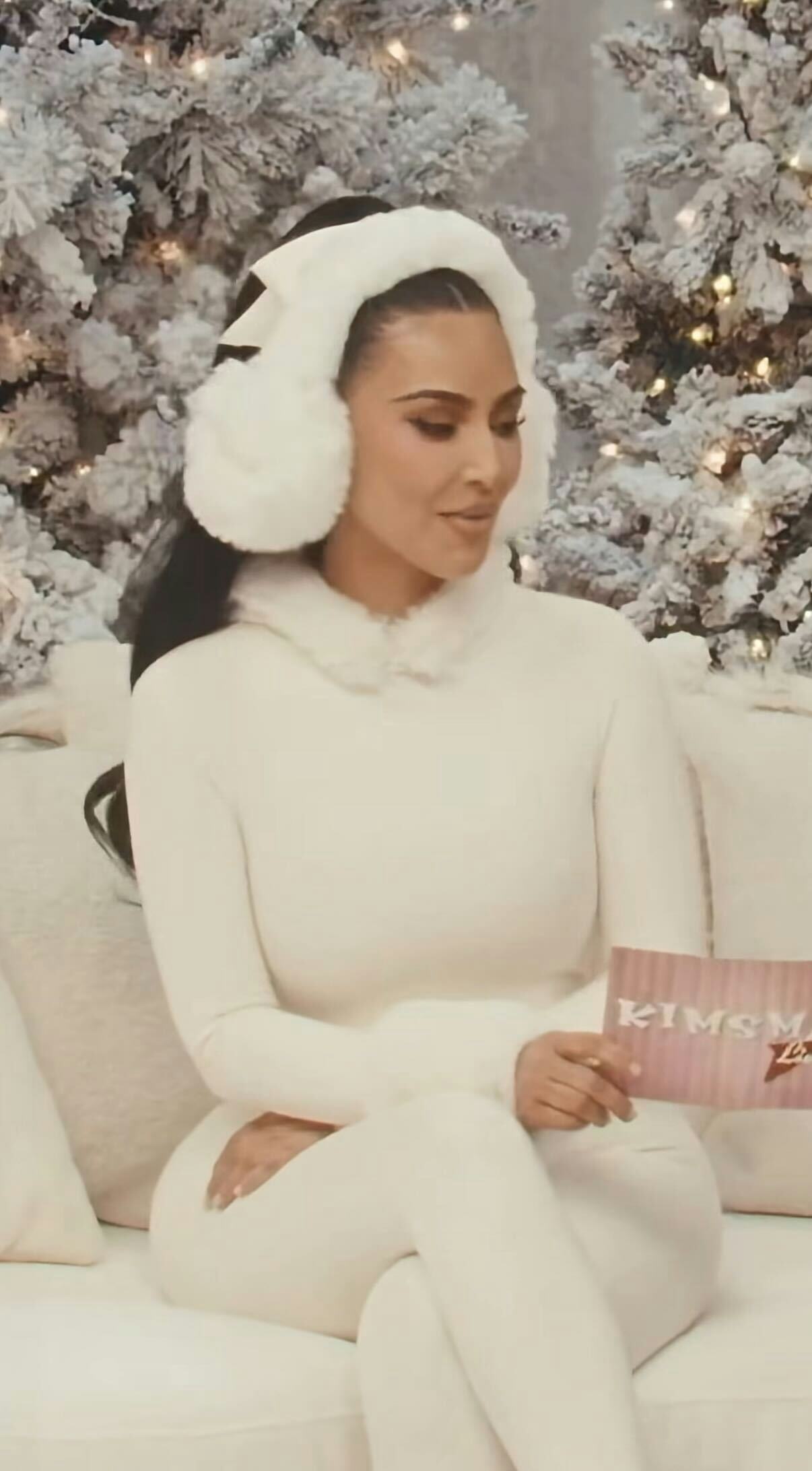 Kim Kardashian wears a white catsuit. 
