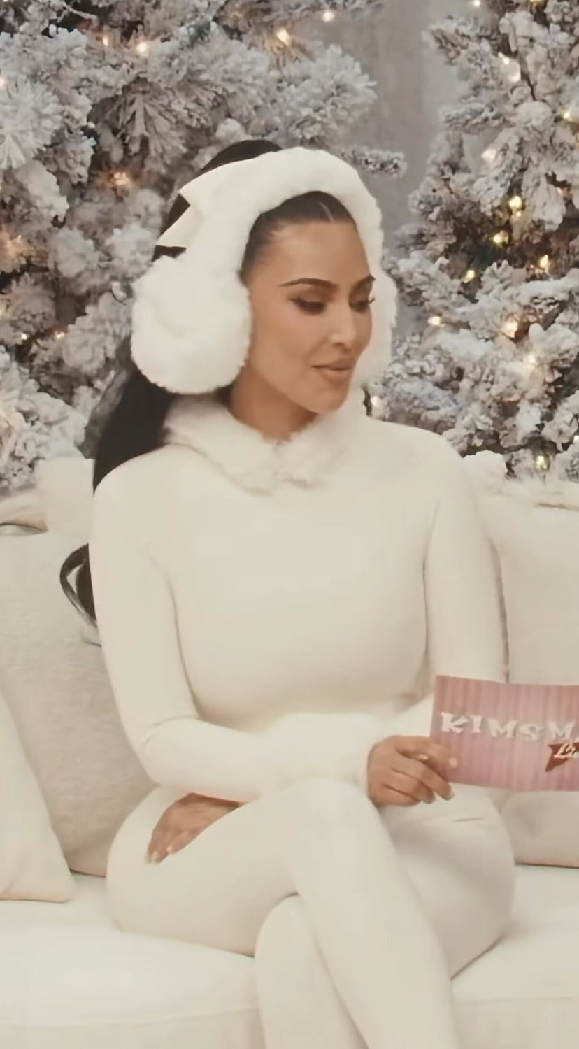 Kim Kardashian wears a white catsuit.