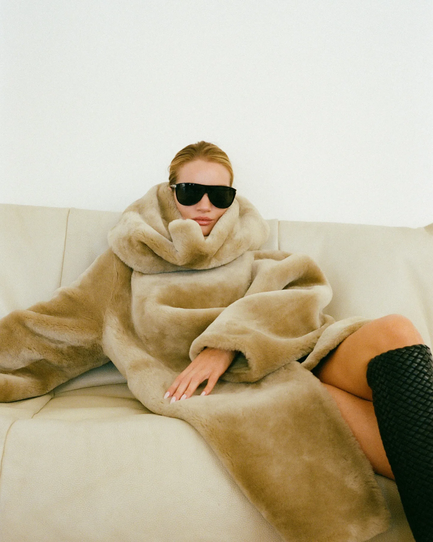 Rosie Huntington-Whiteley wears a fur coat and quilted boots. 