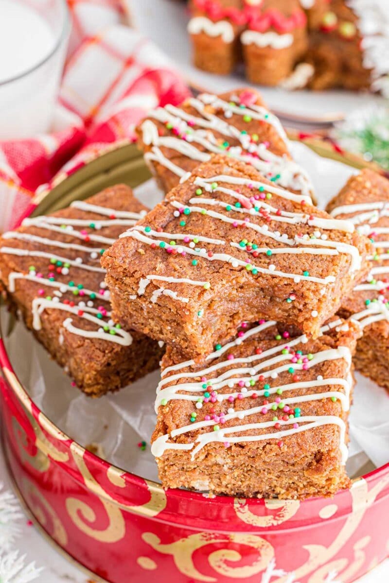 gingerbread blondies in a christmas tin, in a story about cheap christmas baking recipes.