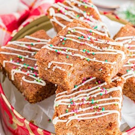 gingerbread blondies in a christmas tin, in a story about cheap christmas baking recipes.