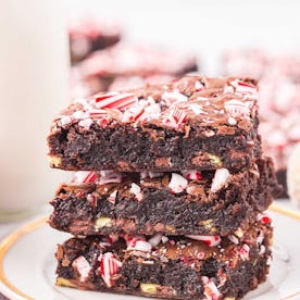 Candy cane brownies in a stack of three, in a story about easy christmas baking recipes