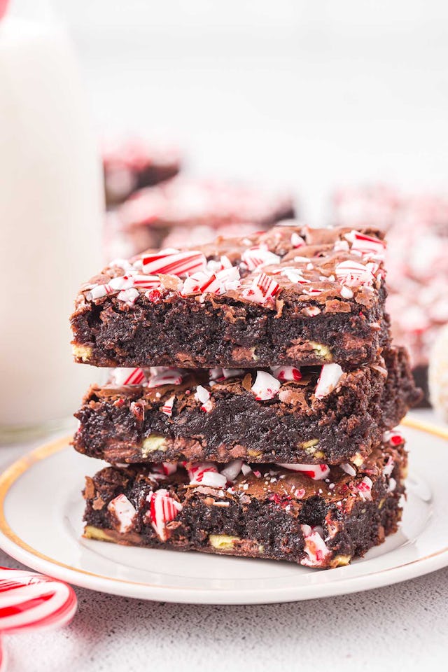 Candy cane brownies in a stack of three, in a story about easy christmas baking recipes