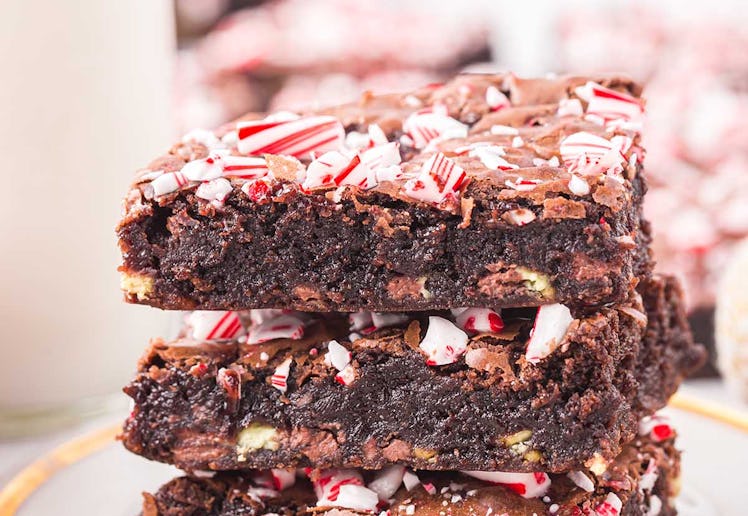 Candy cane brownies in a stack of three, in a story about easy christmas baking recipes