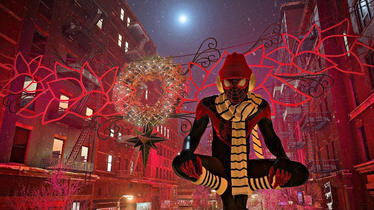 SPider-Man sits atop a street light wearing a winter hat and scarf in front of holiday decorations.