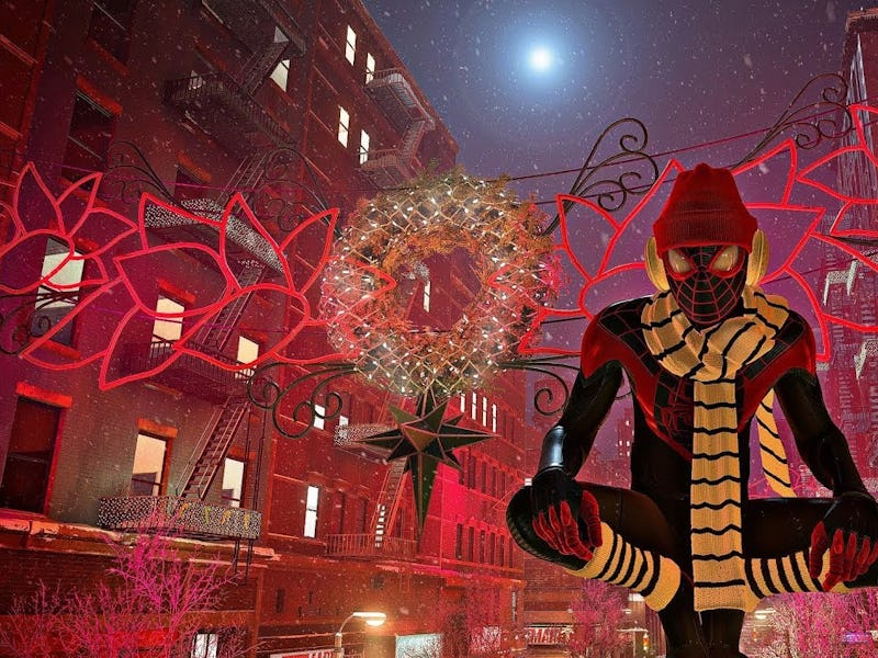 SPider-Man sits atop a street light wearing a winter hat and scarf in front of holiday decorations.
