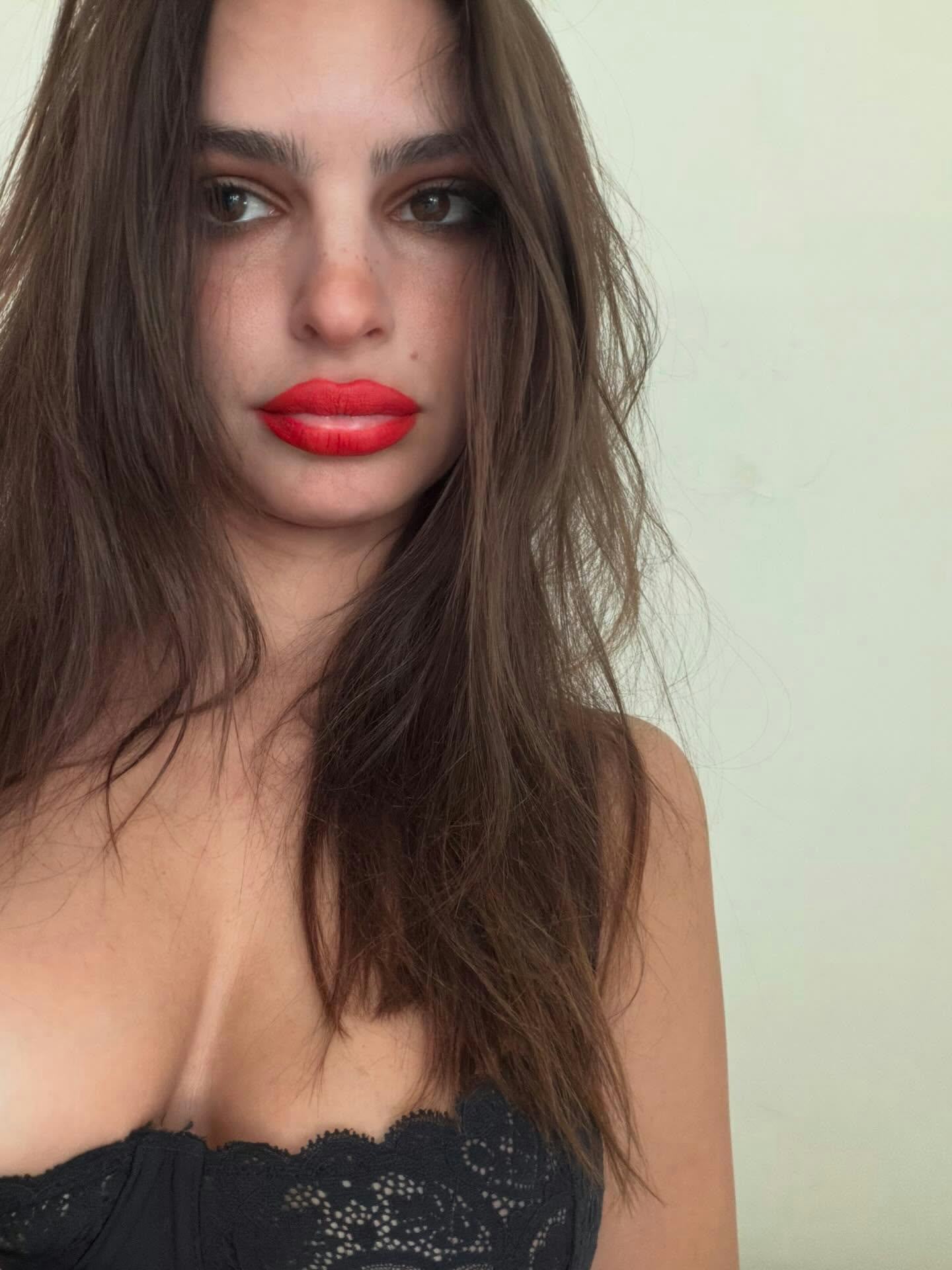 Emily Ratajkowski wears a lace bra. 