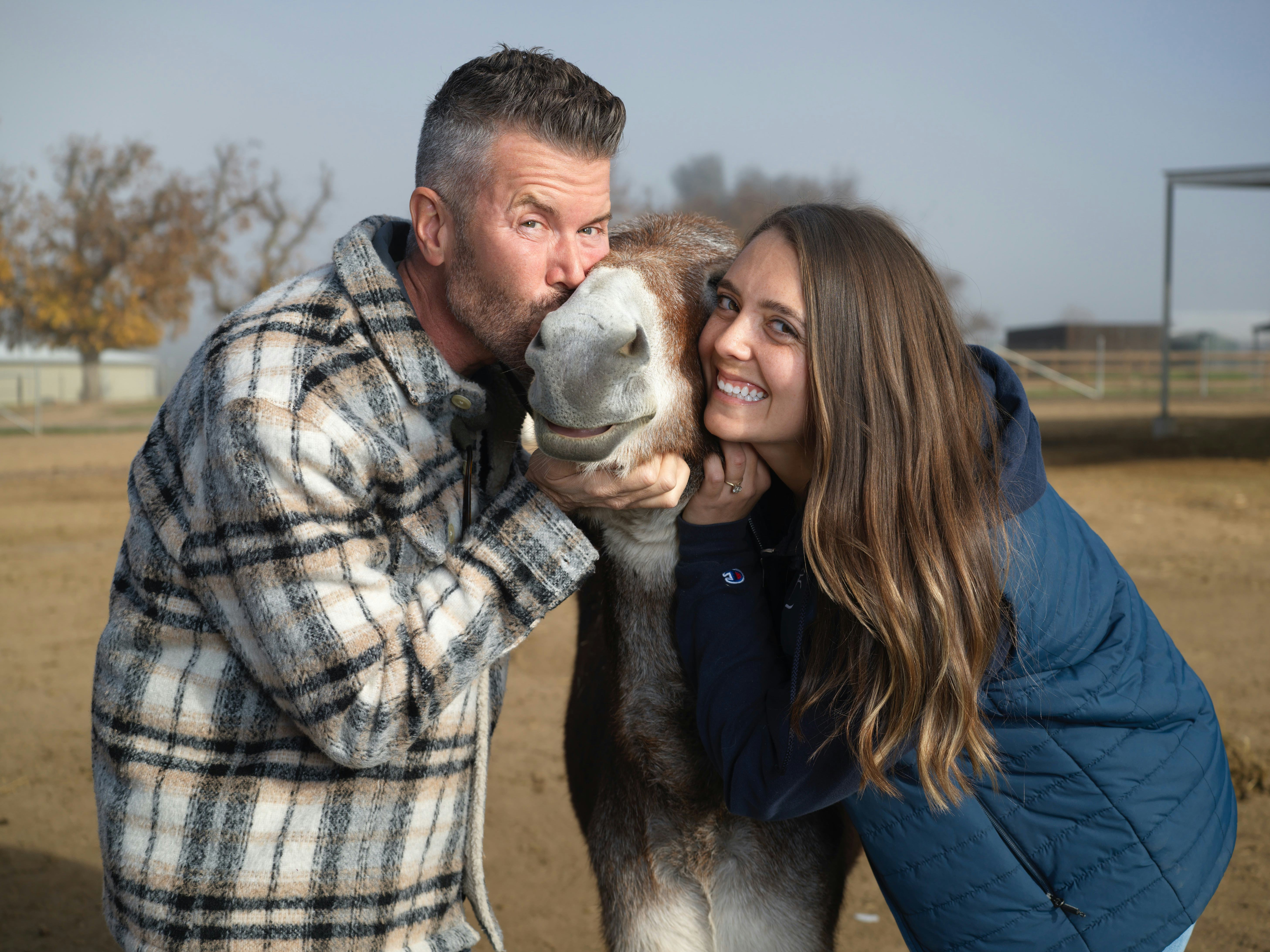 The Oscar's Place team poses with a donkey.