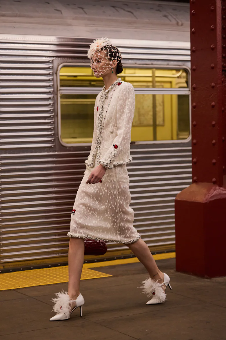 a look from chanel's metiers d'art show in new york city in a subway station