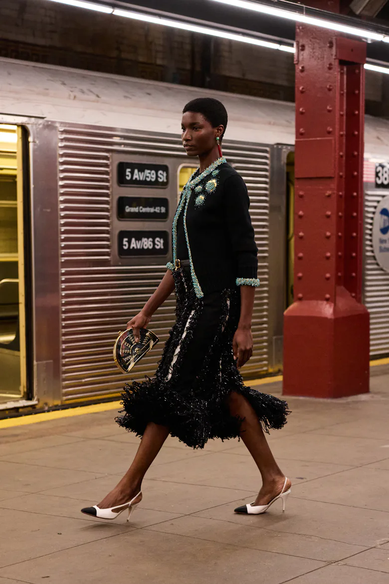 a look from chanel's metiers d'art show in new york city in a subway station