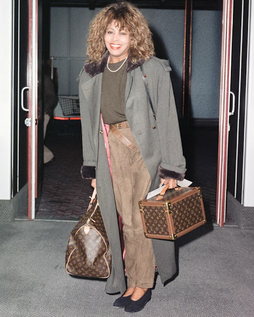 Tina Turner with two Louis Vuitton monogram bags