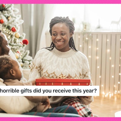 A woman smiles politely at a bad Christmas gift.
