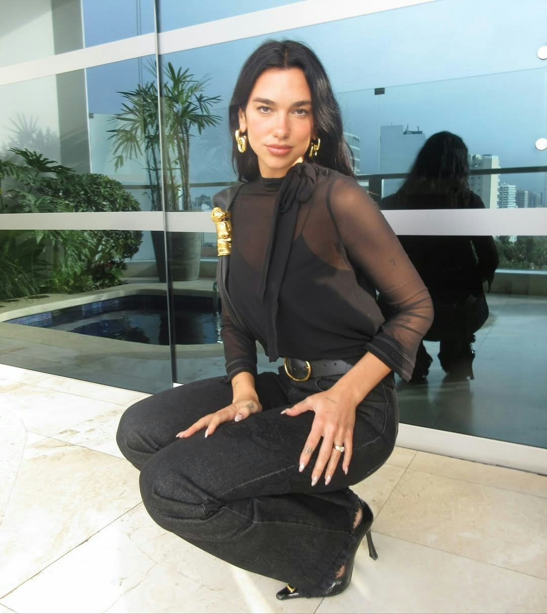 Dua Lipa Went Braless In A Midriff-Baring Top On Vacation In Mexico City