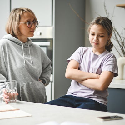 A mother has a serious conversation with her daughter.