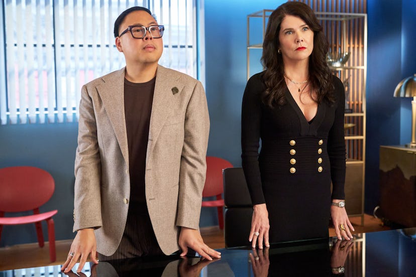 Nico Santos and Lauren Graham standing at a conference table in ‘The Z-Suite.'