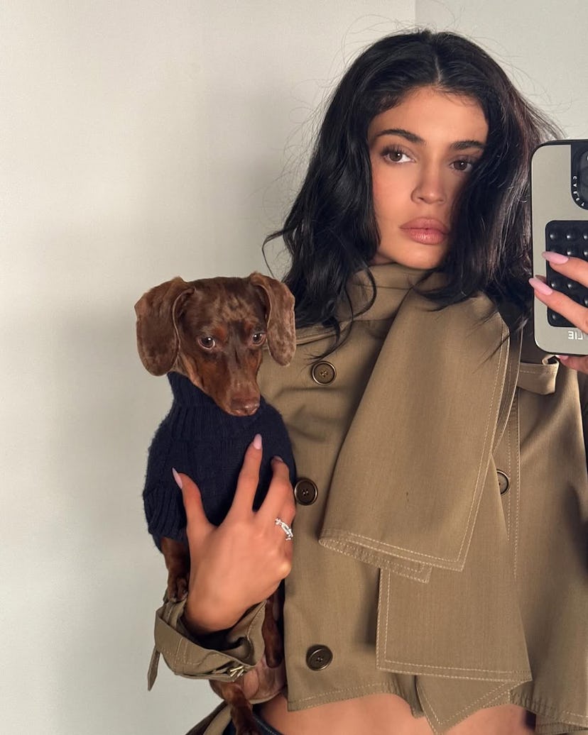 Kylie Jenner wearing a high-low cropped trench coat.