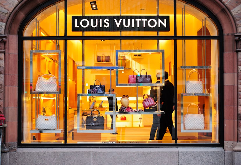 Louis Vuitton store with bags in the window.