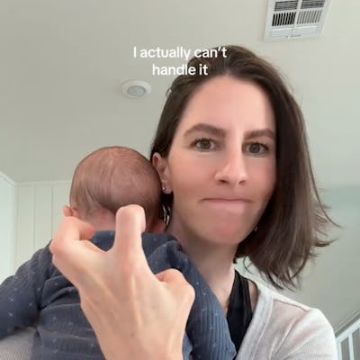 A woman holds a baby in her arms, showing a playful expression while making a hand gesture. The text above reads, "I actually can't handle it."