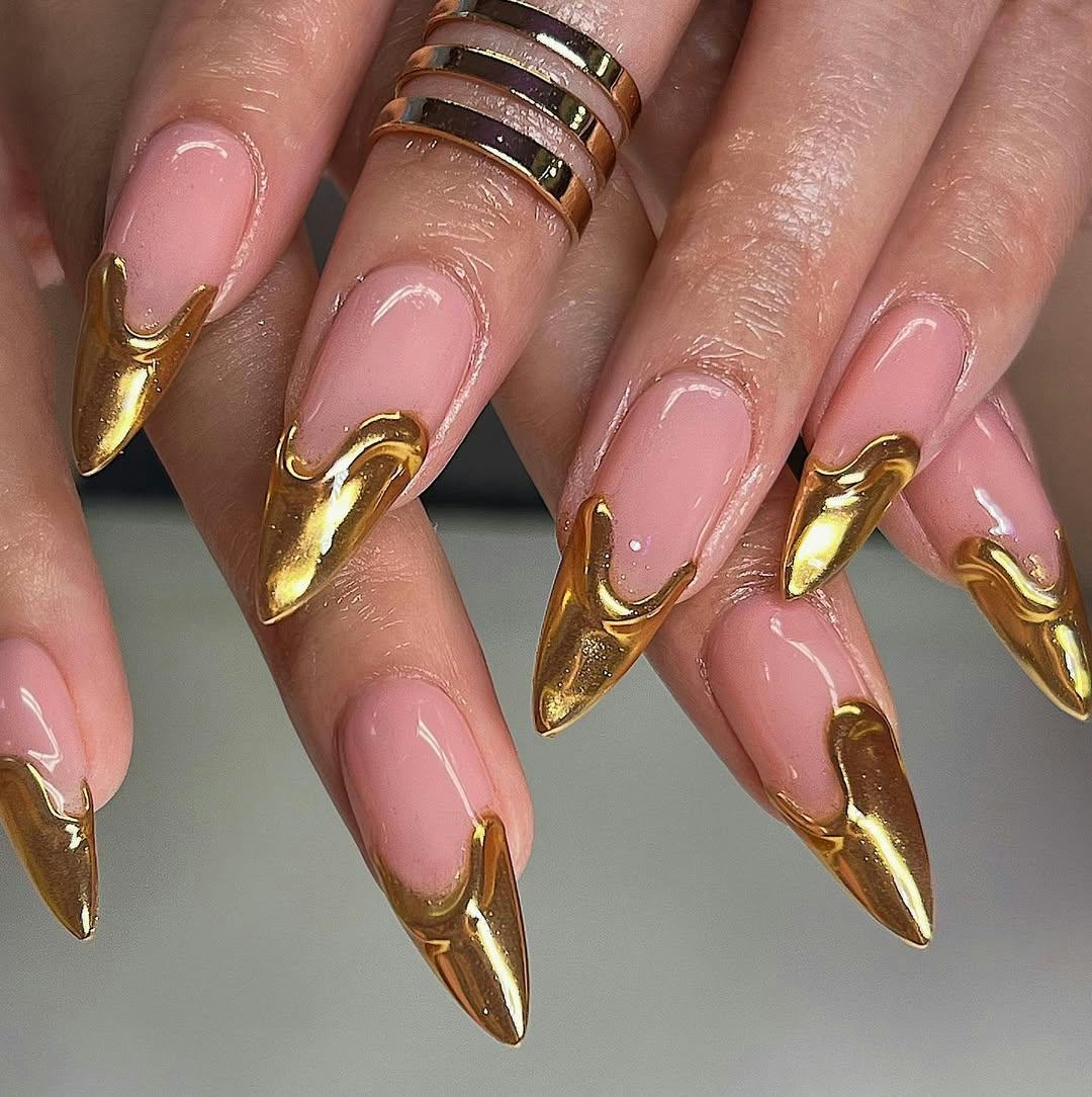 Stiletto French nails with gold chrome tips