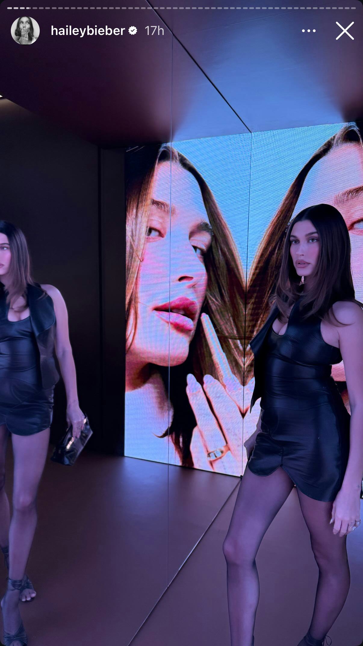 Hailey Bieber wears a brown minidress.