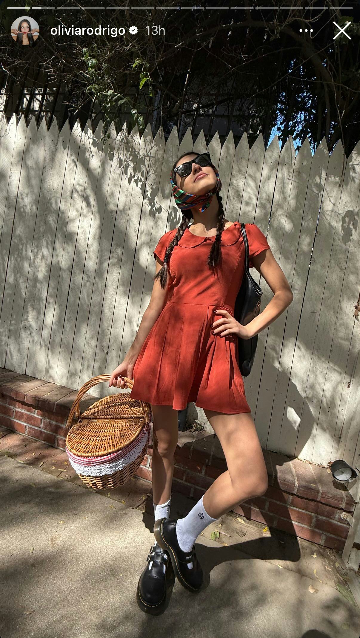 Olivia Rodrigo wears a sleeved minidress with a Peter Pan collar.