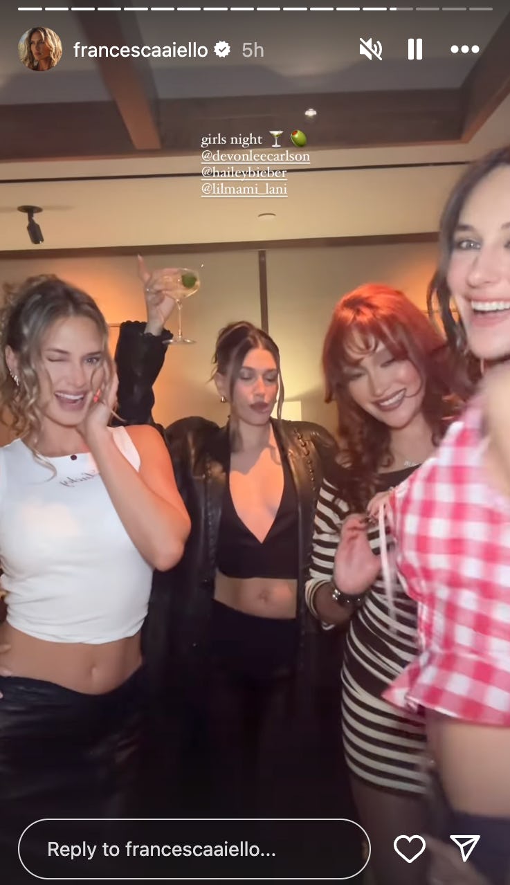 Hailey Bieber wears a plunging top with her friends.