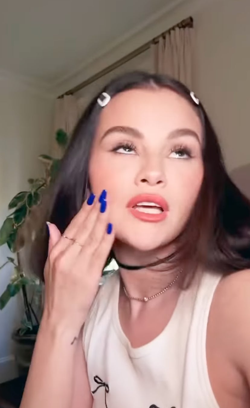 Photo of Selena Gomez wearing a royal blue manicure