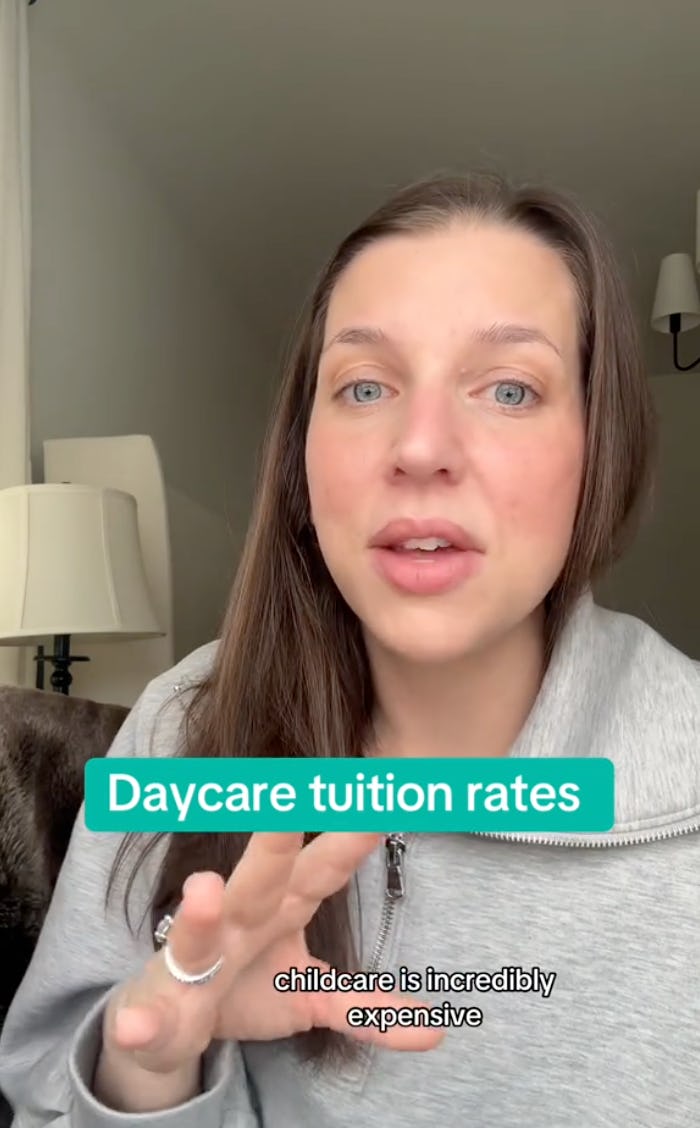 A woman with long brown hair speaks directly to the camera, discussing high daycare tuition rates. A lamp and window are visible in the background.