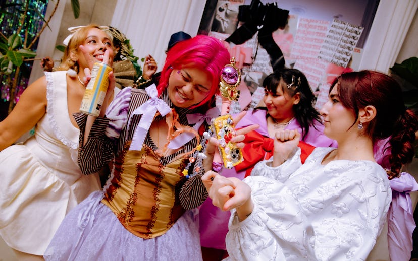 Attendees at a magical girl-themed party show off their outfits.