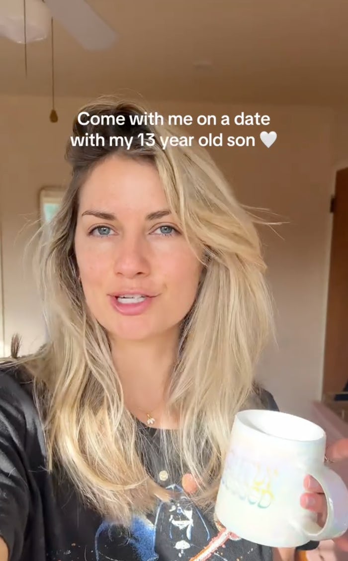 A woman with long, blonde hair smiles while holding a mug, inviting viewers to join her on a date with her 13-year-old son.