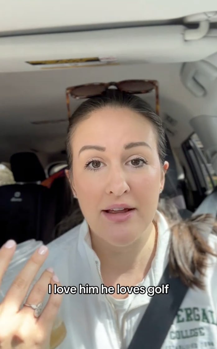 A woman speaking in a car, expressing her affection for her husband who loves golf. She has dark hair and is wearing a light jacket.