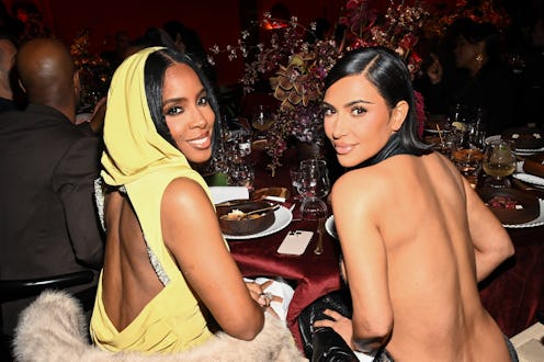 Kelly Rowland and Kim Kardashian wearing backless dresses at the Fifteen Percent Pledge Gala.