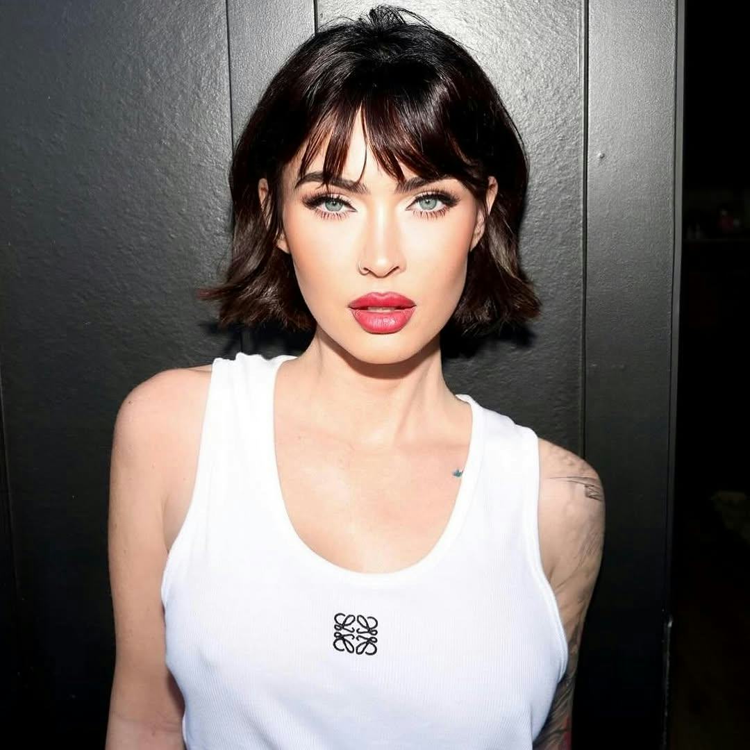 Megan Fox with major 2025 hair trend, wispy bangs.