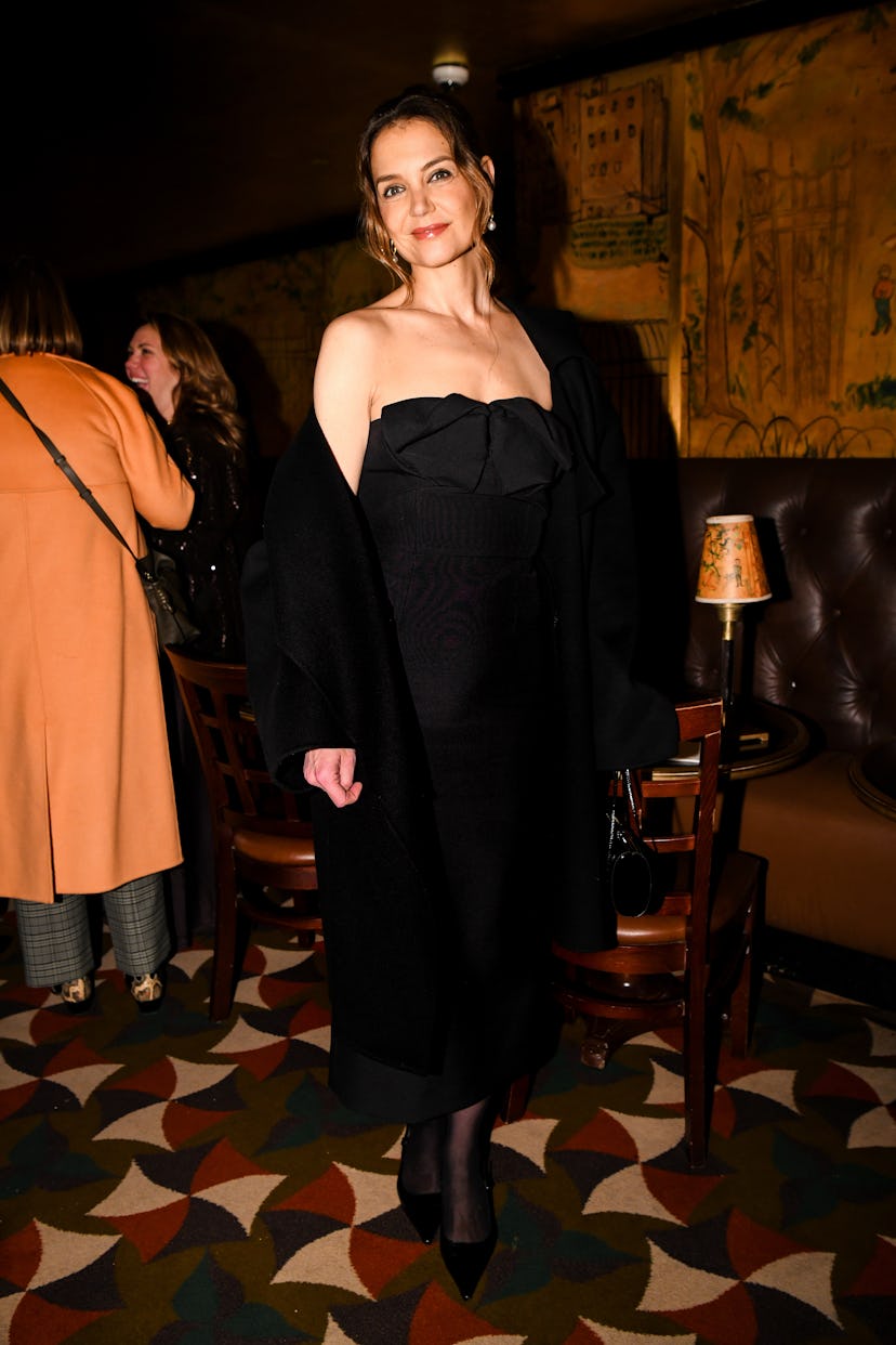 Katie Holmes at an event wearing a black dress