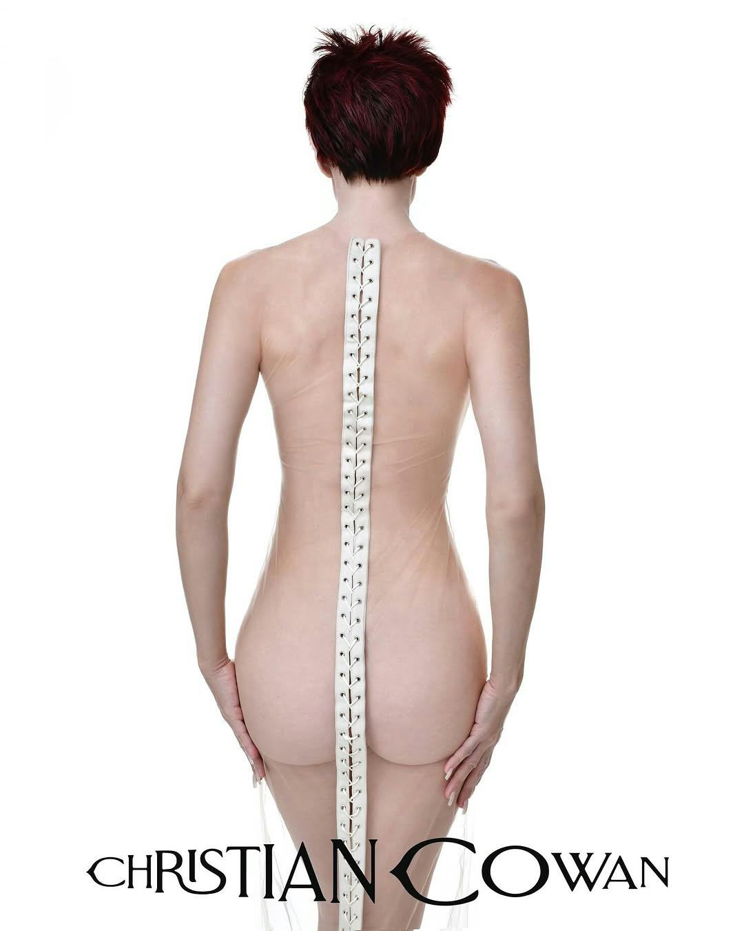 Julia Fox wears a butt-baring dress.