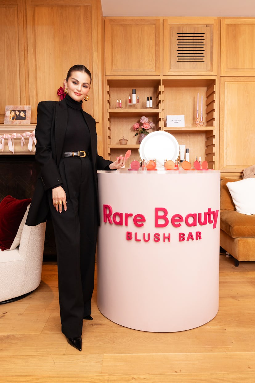 Selena Gomez wears a black pantsuit.