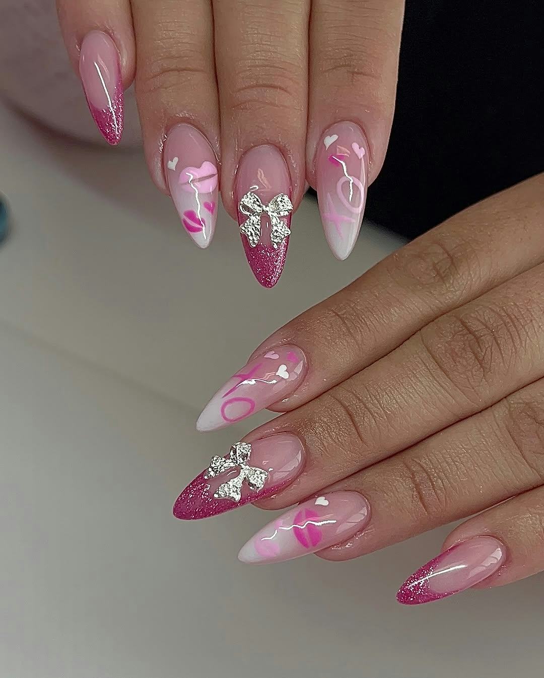 almond-shaped pink French manicure with 3D nail art