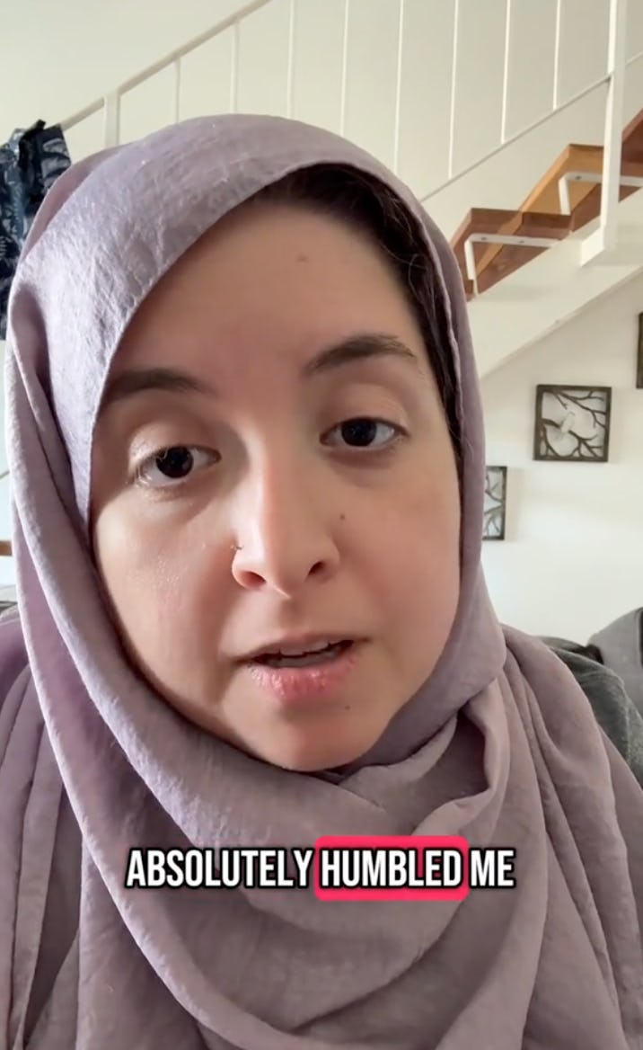 A woman wearing a lilac hijab speaks directly to the camera, expressing emotion. Text overlay reads, "ABSOLUTELY HUMBLED ME." The background shows a cozy indoor setting.