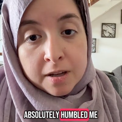 A woman wearing a lilac hijab speaks directly to the camera, expressing emotion. Text overlay reads, "ABSOLUTELY HUMBLED ME." The background shows a cozy indoor setting.