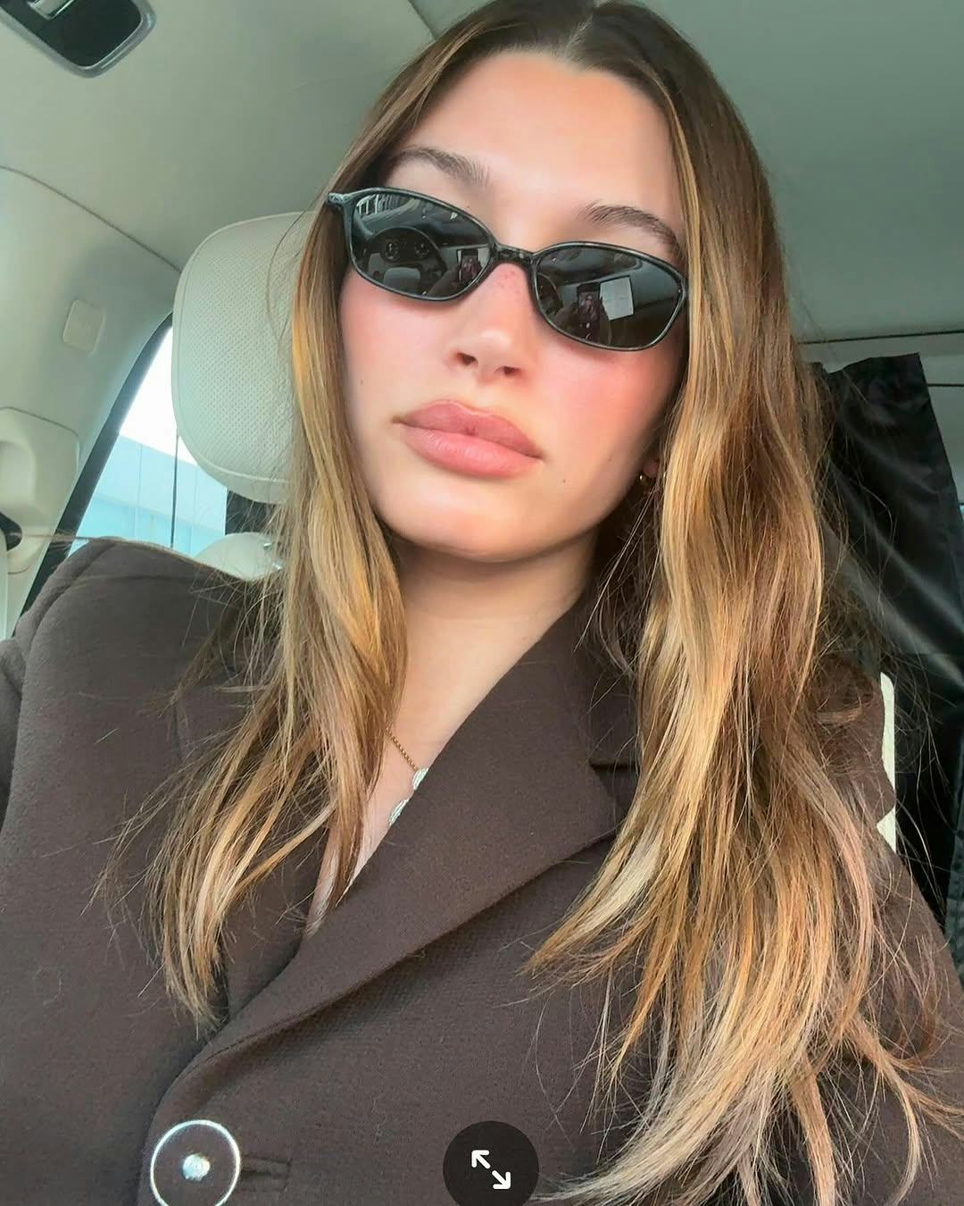 Hailey Bieber's glazed pink nails are perfect for spring.