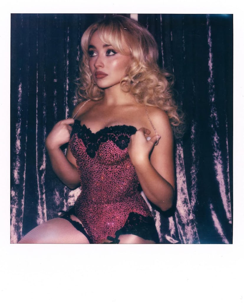 Sabrina Carpenter wears a sheer lace dress.