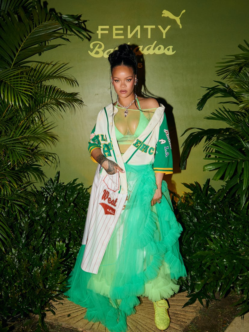 Rihanna wears a green sheer dress.