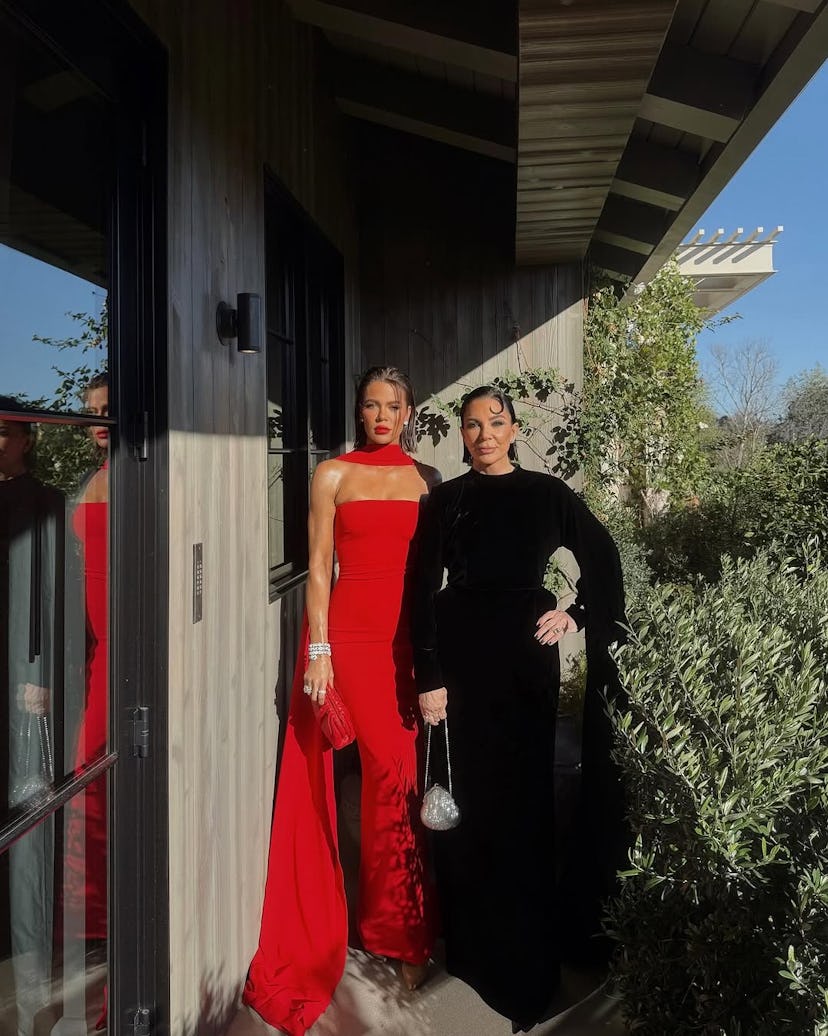 Khloe Kardashian and Kris Jenner in red and black gowns.